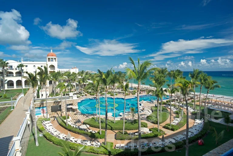 Oceanfront pool view at Riu Palace Cabo San Lucas with direct airport shuttle service available